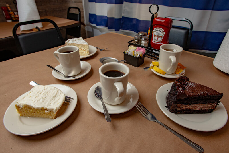 Desserts and coffee drinks on set table