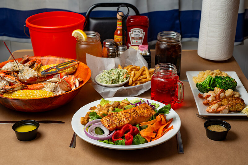Multiple entrees with focus on salmon salad entree
